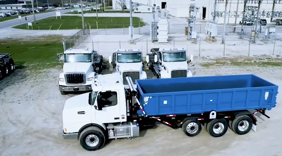 Aerial view of the Amarillo Dumpster Pro truck fleet staged in the equipment yard